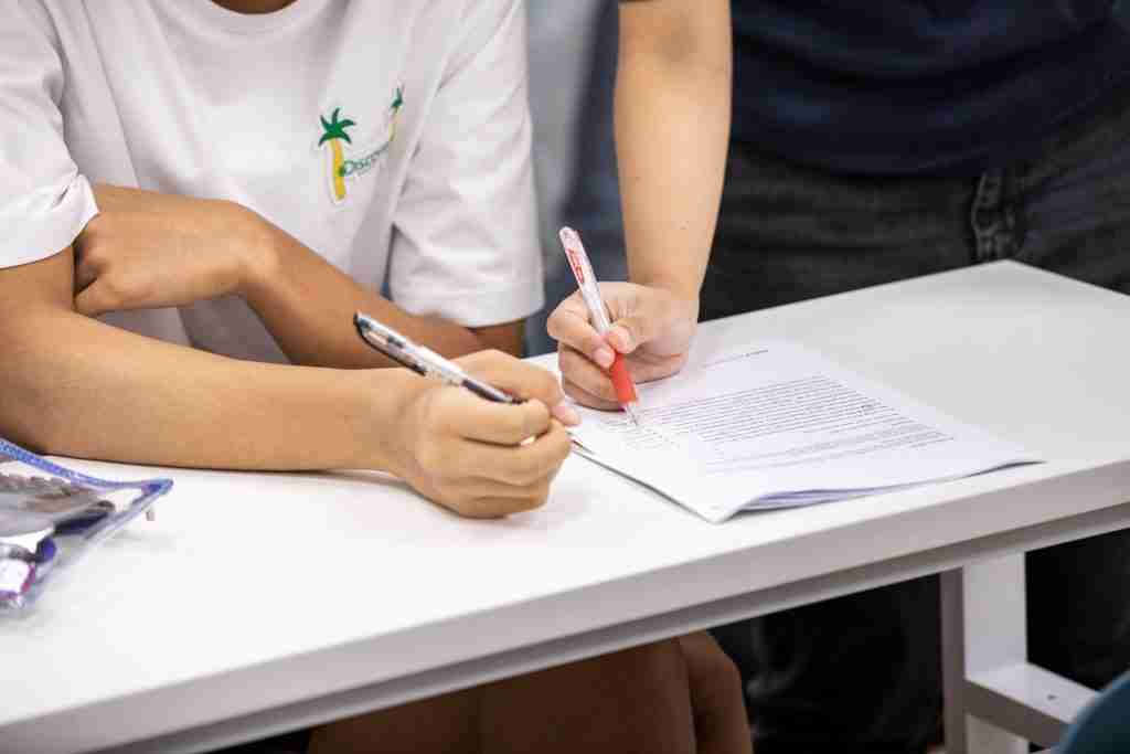 teacher gives close feedback for O level oral