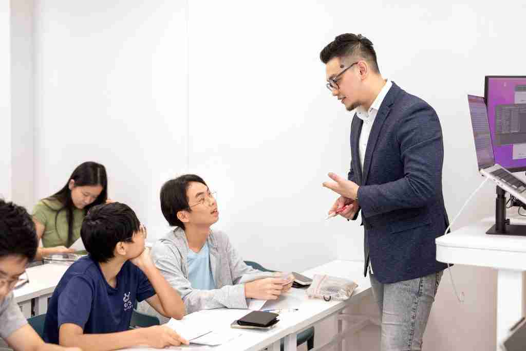 students paying attention to their tutor Mr Chia