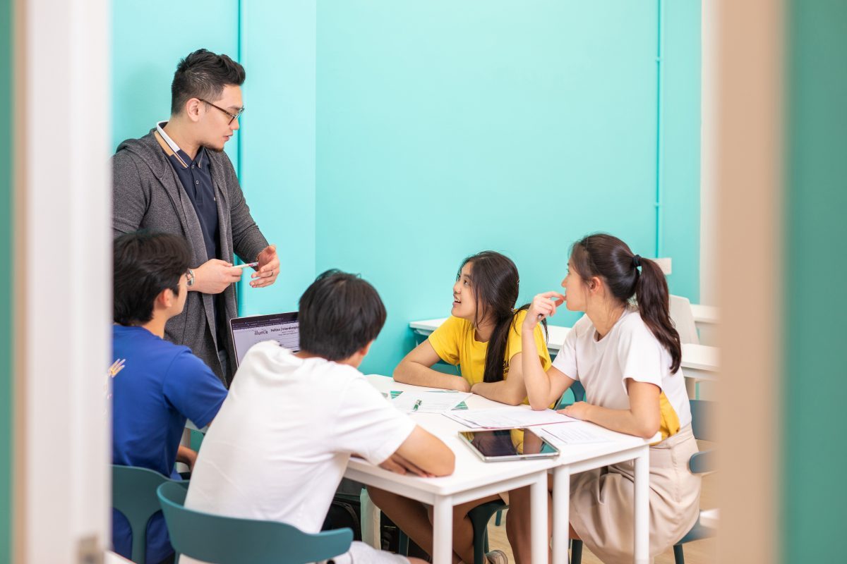 teacher and students in our gp tuition centre in singapore
