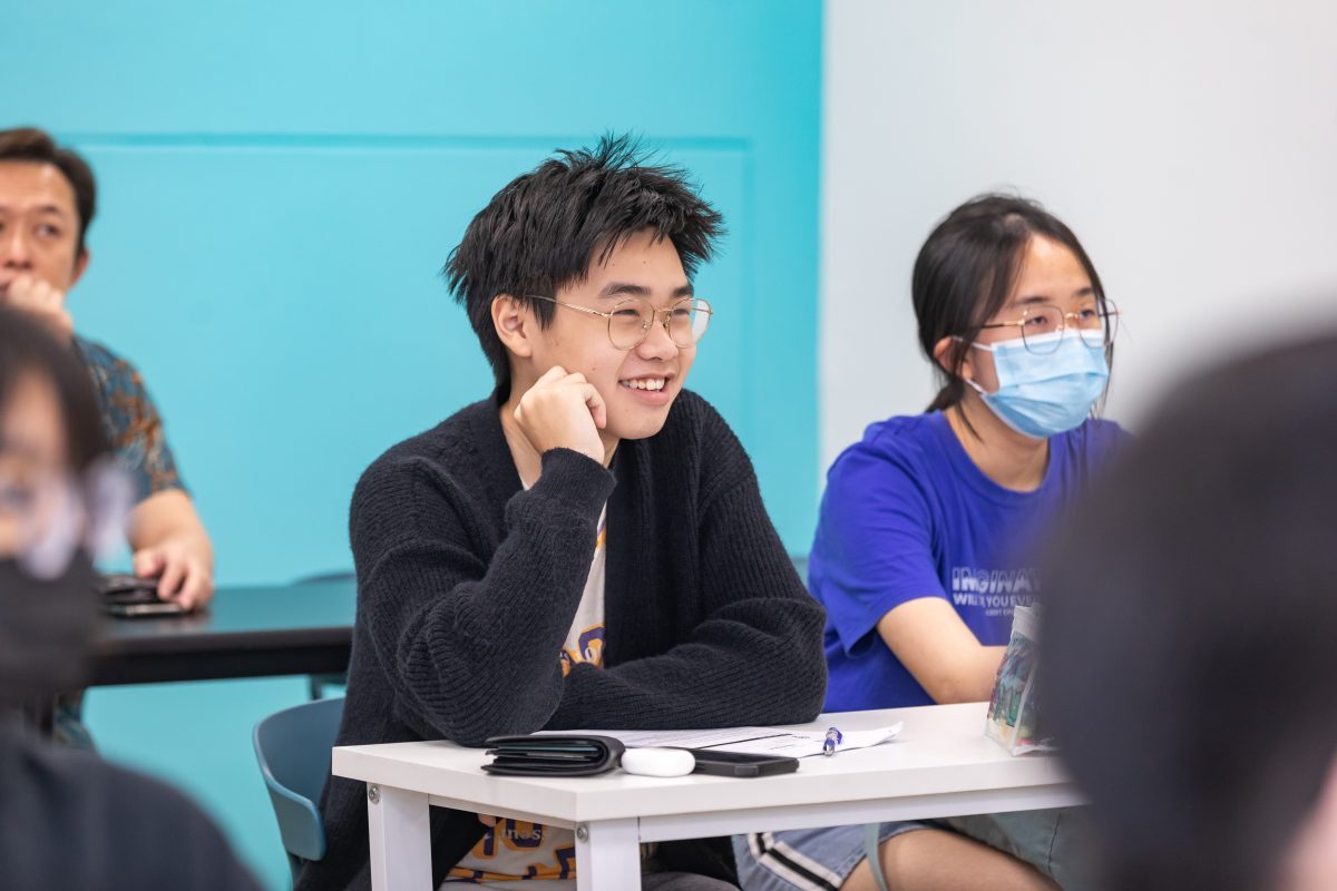 student smiling during humanities tuition