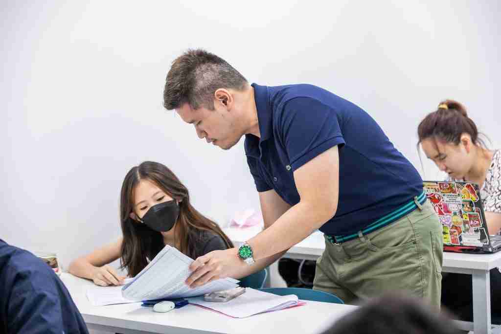 Mr David Lee giving close feedback during Humanities Tuition