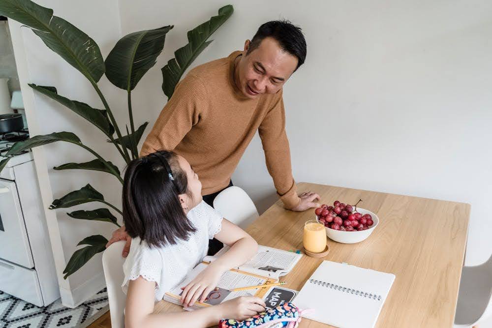 father checking in on his daughter’s secondary school preparation
