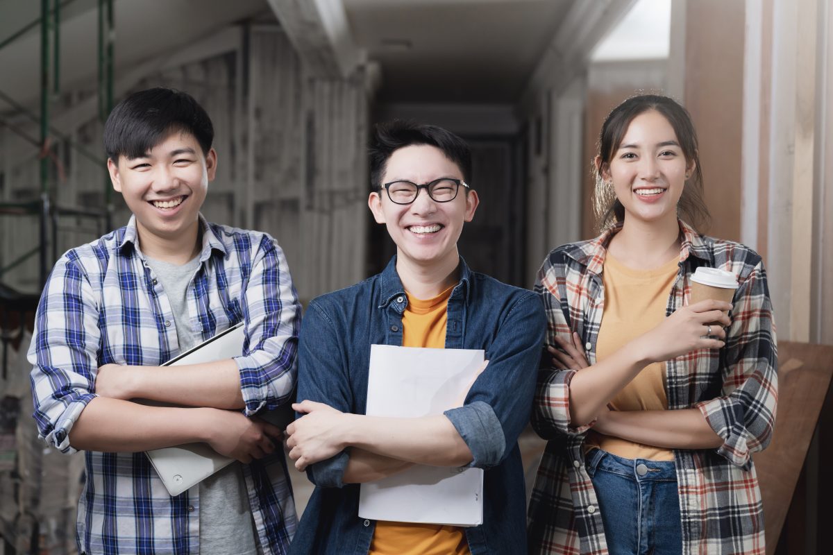 Students from polytechnic smiling at camera