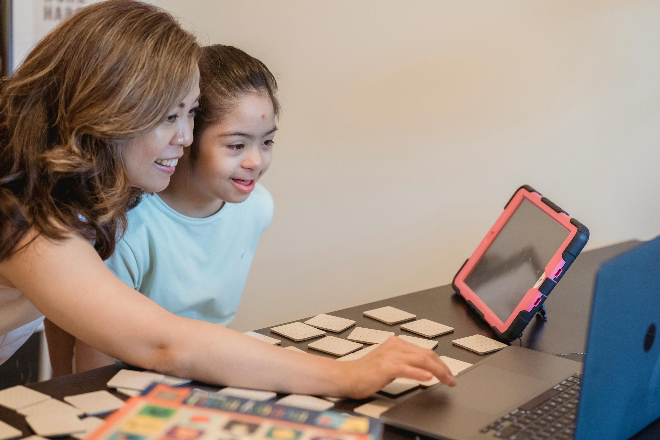A parent helps her child with her studies following a parent-teacher meeting.