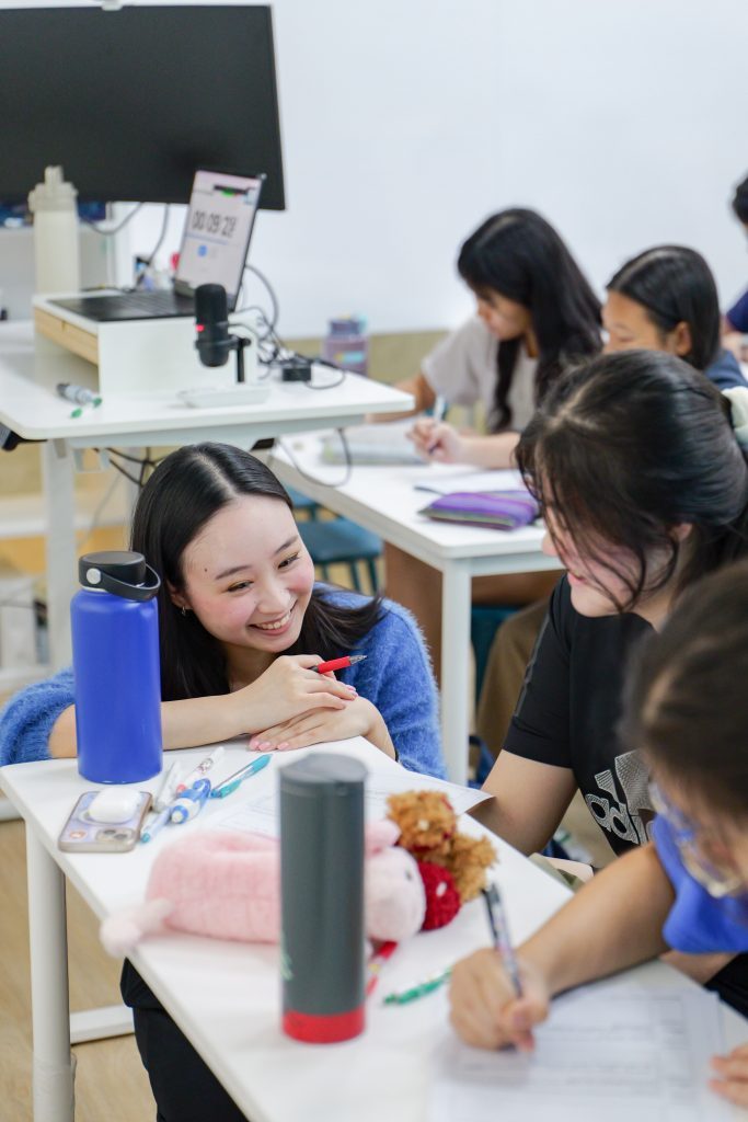 Miss Ze Qin goes through GP questions with students during GP lessons at illum.e